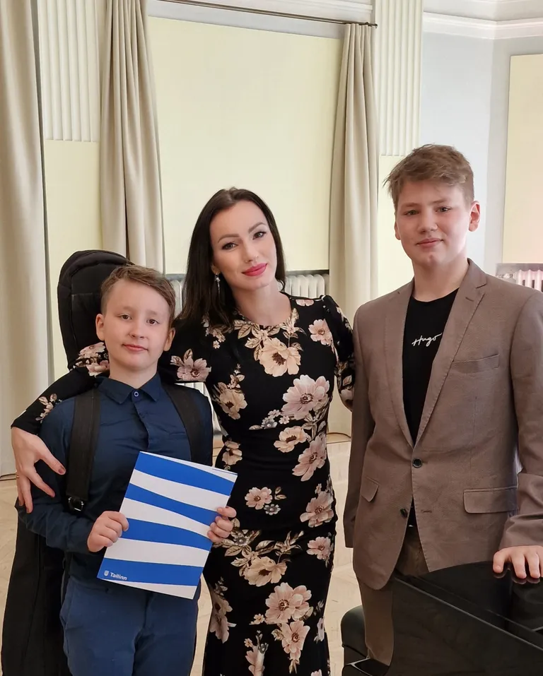 Silvia Ilves koos poegadega, Tristani ja Stefaniga.